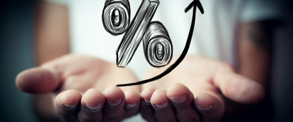 rising percentage sitting on top of pair of hands