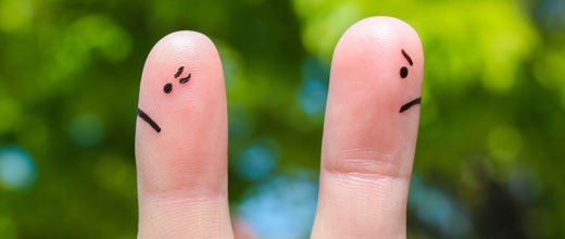 finger with faces facing away from each other