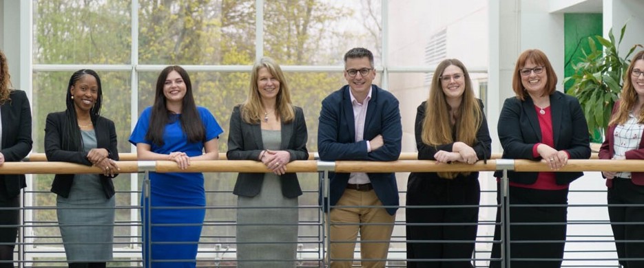 Team photo of staff on walkway