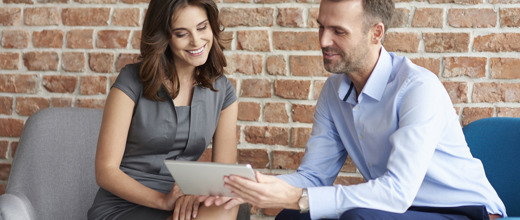 two people discussing document