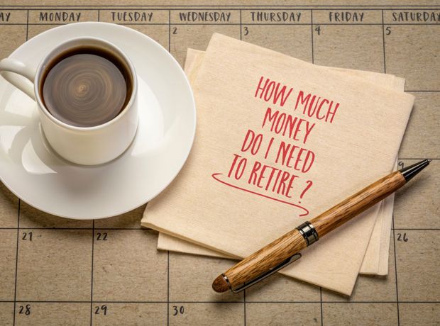 How much do i need to retire on notepad next to cup of coffee