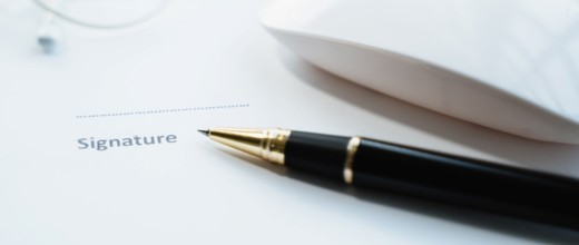 Pen laid ready to sign document