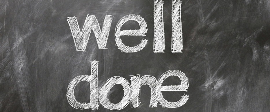 Well Done chalked on blackboard