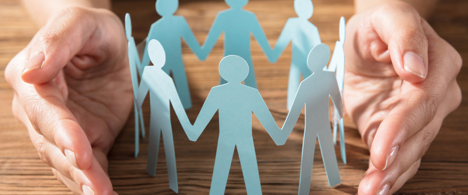 hands around paper cut out people