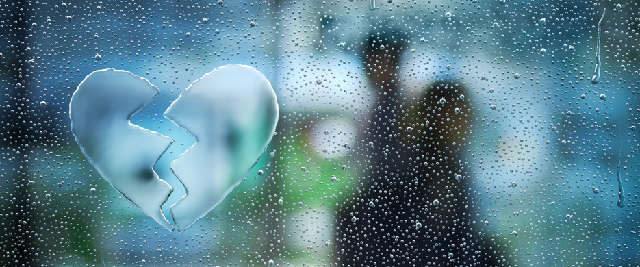 Broken Heart in water droplets on window