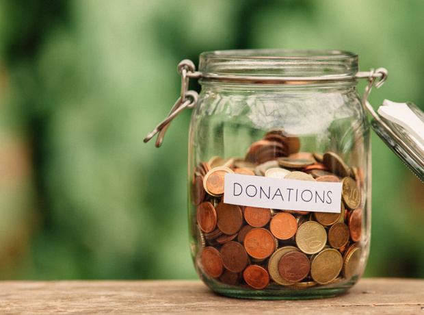 coins in a jar marked donations