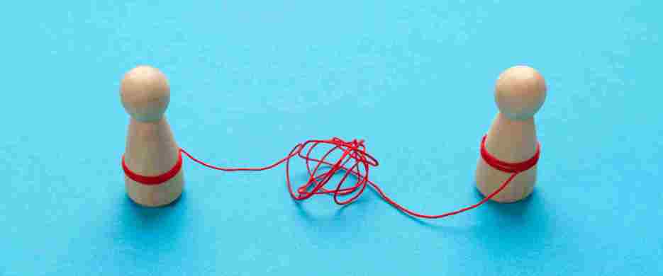 Wooden People Attached By Red String