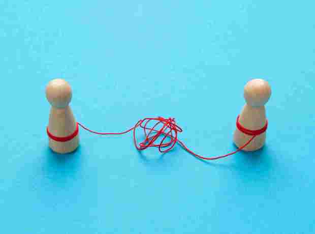 Wooden People Attached By Red String