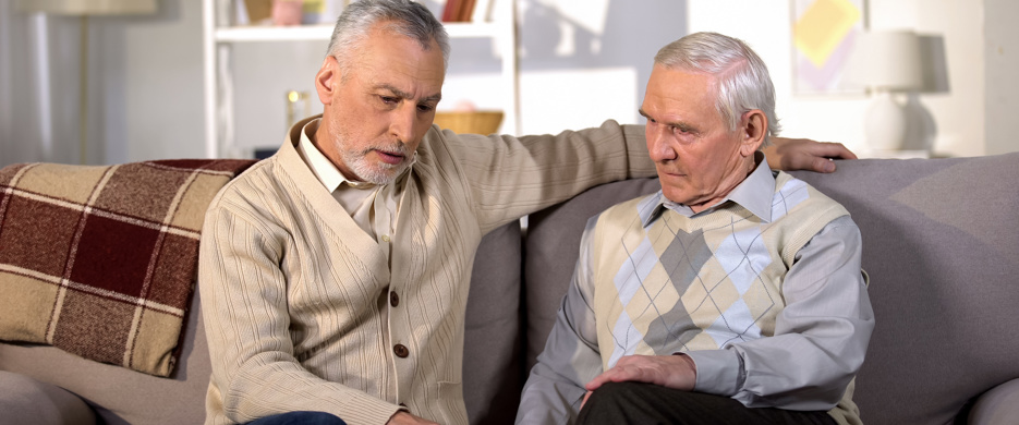 Son talking to elderly father