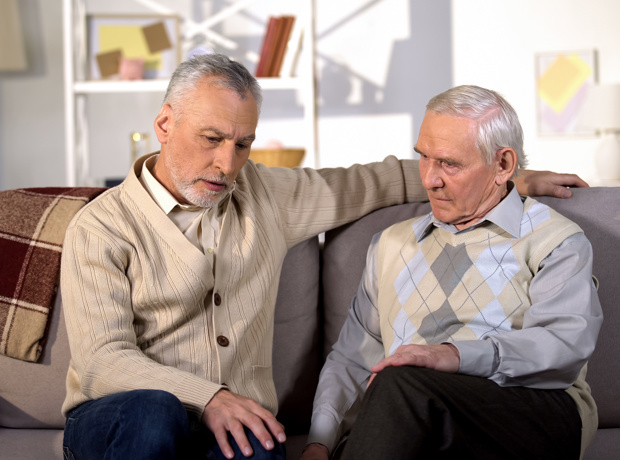Son talking to elderly father