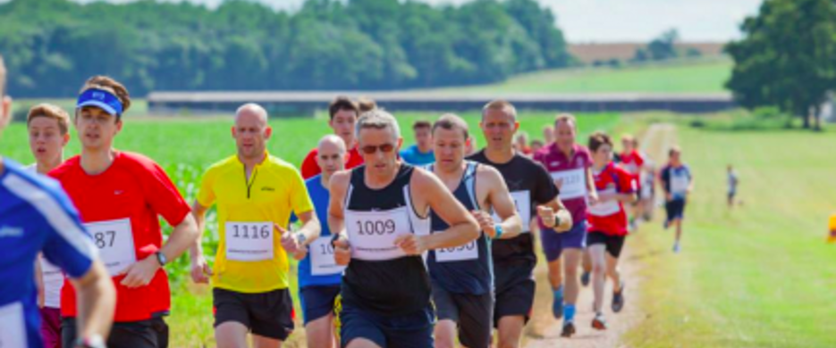 competitors running through park