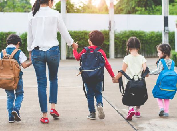 mother with four small children walking