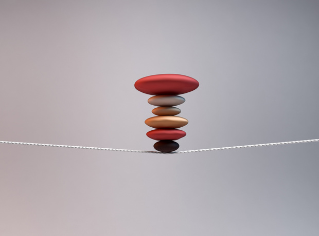 pile of stones balanced on string